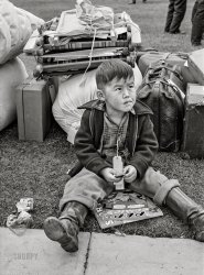 May 1942. "Salinas, California. Tagged for evacuation. Removal of Japanese enemy aliens from San Juan Bautista and San Benito County to reception center at Salinas, California." Acetate negative by Russell Lee for the Office of War Information. View full size.