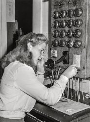 July 1942. "Oakridge, Oregon. Population 520. Town telephone switchboard." Medium format acetate negative by Russell Lee for the Farm Security Administration. View full size.