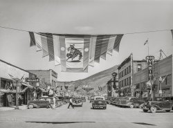 July 1941. "Main street of Vale, Oregon, on the Fourth of July. Vale is one of the shopping centers for farmers who live and work on the Vale-Owyhee irrigation project." Medium format acetate negative by Russell Lee for the Farm Security Administration. View full size.