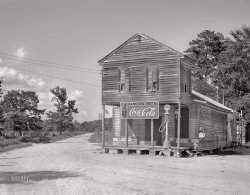 August 1936. "Crossroads store and post office. Sprott, Alabama." Last glimpsed here. 8x10 inch acetate negative by Walker Evans for the U.S. Resettlement Administration. View full size.