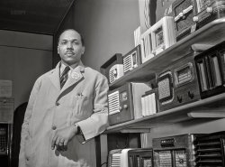 April 1942. "Chicago, Illinois -- Negro business and professional men and women. William H. Green, owner of a radio and electrical store on 47th Street near Indiana Avenue. Mr. Green has been in the radio business for nine years, in the same store." Photo by Jack Delano for the Foreign Information Service of the U.S. Office of Coordinator of Information. View full size.