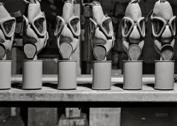 June 1942. "Edgewood Arsenal, Maryland. Gas demonstration. Gas masks ('Universal' size) reconditioned for civilian defense use at the gas mask factory." Medium format acetate negative by Jack Delano for the Office of War Information. View full size.