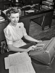 September 1942. "Detroit, Michigan. Office worker at aircraft engine plant, Allison Division of General Motors." Photo by Arthur Rothstein for the Office of War Information. View full size.