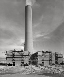 September 1942. Deer Lodge County, Montana. "Anaconda Smelter of the Anaconda Copper Mining Co. The smokestack is the largest in the world: 585 feet in height with a diameter at base of seventy-five feet and at top of sixty feet. Flue gases are discharged at the rate of three to four million cubic feet per minute. The arsenic plant and flue gas cleaning apparatus are seen at the base of the stack." Photo by Russell Lee, Office of War Information. View full size.