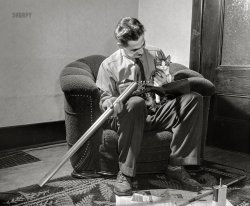 November 1942. "Pittsburgh, Pennsylvania (vicinity). Montour No. 4 mine of the Pittsburgh Coal Company. Assistant superintendent getting ready for a hunting trip." Medium format acetate negative by John Collier for the Office of War Information. View full size.
