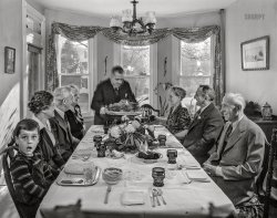 November 1942. "Neffsville, Pennsylvania. Serving the turkey at Thanksgiving dinner in the home of Earle Landis." Photo by Marjory Collins, Office of War Information. View full size.