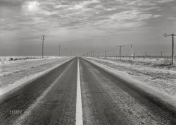 November 1942. "Deaf Smith County, Texas. Panhandle highway." Medium format acetate negative by John Vachon for the Office of War Information. View full size.