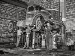 March 1943. "Baltimore, Maryland. Davidson Transfer Company trucking terminal. Lubricating a truck tractor." Acetate negative by John Vachon, Office of War Information. View full size.