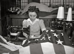 March 1943. "Verona, New Jersey. Sewing the edge of an American flag at the Annin Flag Company." Acetate negative by Marjory Collins for the Office of War Information. View full size.
