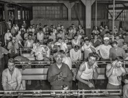 March 1943. "Albuquerque, New Mexico. Workmen washing up at the end of the day at the Atchison, Topeka and Santa Fe Railroad locomotive shops."  Medium format acetate negative by Jack Delano for the Office of War Information. View full size.