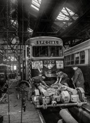 April 1943. "Baltimore, Maryland. Repairing the motor of a PCC (Presidents' Conference Committee) trolley -- the most recent streetcar model, designed in 1936 by a group of manufacturers and transit companies in an effort to standardize, simplify, and bring down the price; at the damage shop, maintenance terminal of the Baltimore Transit Company." Acetate negative by Marjory Collins for the Office of War Information. View full size.
