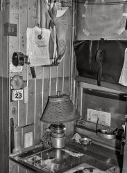 March 1943. "Santa Fe Railroad conductor's work table in the caboose enroute to Gallup, New Mexico." Acetate negative by Jack Delano for the Office of War Information. View full size.