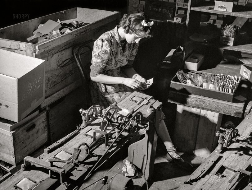Seed Dealer Sealer: 1943 April 1943. "Philadelphia, Pennsylvania. Sealing envelopes containing seed at the W. Atlee Burpee Company, seed dealers." Acetate negative by Arthur Siegel. View full size.