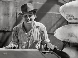 March 1943. "New Orleans, Louisiana. Poydras Street dock worker." Medium format acetate negative by John Vachon for the Office of War Information. View full size.