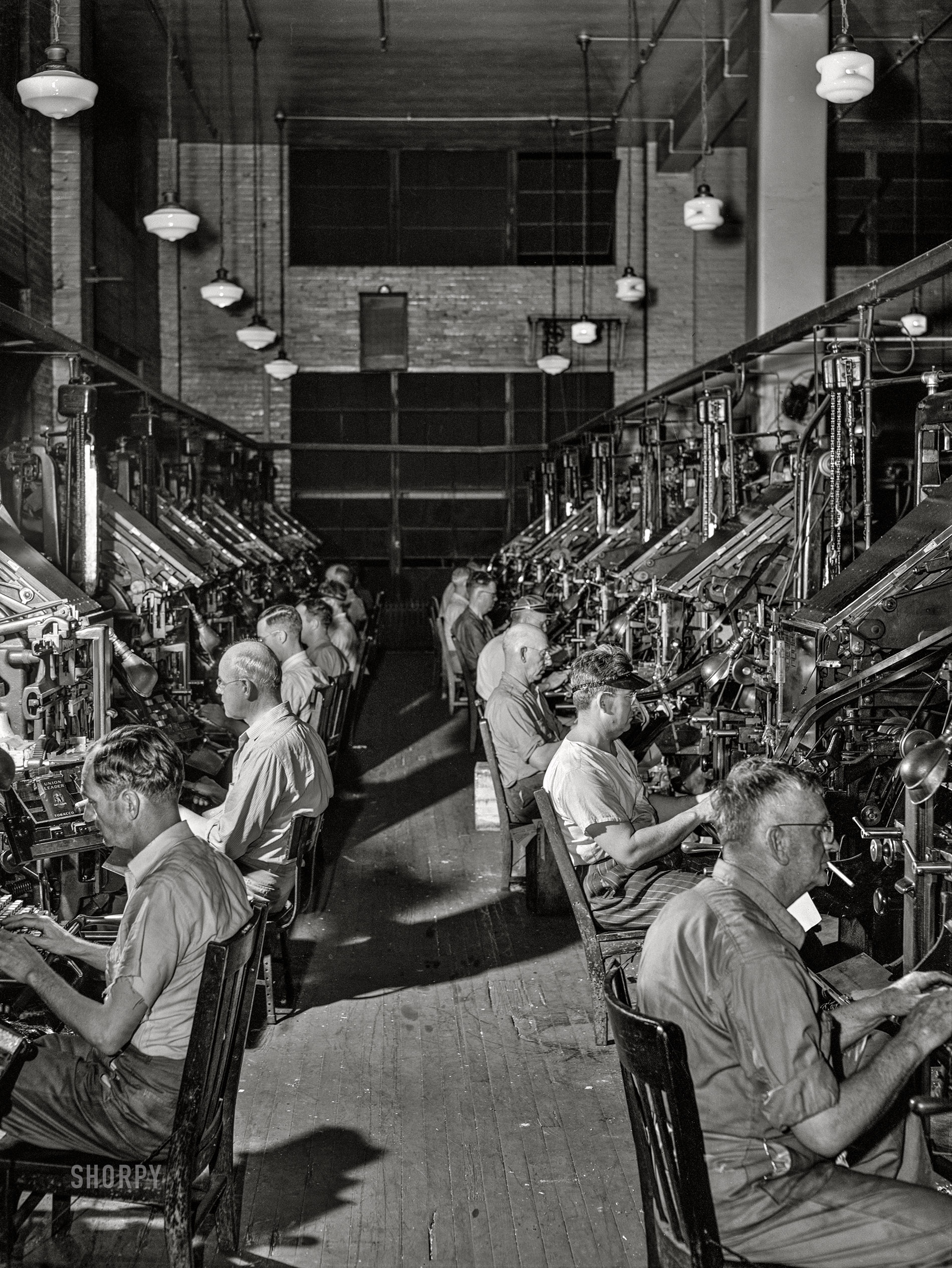 April 1943. "Dallas, Texas. Linotype operators at the Dallas Morning News." Medium format acetate negative by John Vachon for the Office of War Information.