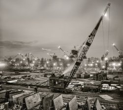 May 1943. "Bethlehem-Fairfield shipyard, Baltimore, Maryland. The shipways at evening." Acetate negative by Arthur Siegel for the Office of War Information. View full size.

&nbsp; &nbsp; &nbsp; &nbsp; In April of 1941, the Bethlehem-Fairfield Shipyard employed around 350, a number that grew exponentially as war production increased. By 1942, 11,000 people worked at the shipyard; in late 1943, the number was at its highest with some 47,000 employees. War production never stopped -- Bethlehem-Fairfield employed three shifts, 24 hours a day, seven days a week, year-round.