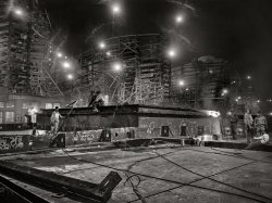 May 1943. "Bethlehem-Fairfield shipyards, Baltimore, Maryland. Welding in front of the shipways at night." Photo by Arthur Siegel for the Office of War Information. View full size.