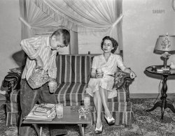 May 1943. Point Pleasant, West Virginia. "Rural life along the Ohio River. Jimmie Ferguson, son of the local junior high school principal, pouring out a glass of lemonade with his mother." Acetate negative by Arthur S. Siegel for the Office of War Information. View full size.
