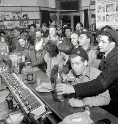 &nbsp; &nbsp; &nbsp; &nbsp; "We'll have what she's having."
April 1943. "Baltimore, Maryland. Third-shift defense workers getting snack at drugstore on corner where their shared car will pick them up around midnight." Photo by Marjory Collins for the Office of War Information. View full size.