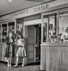 June 1943. Arlington, Virginia. "Service shop in Idaho Hall, Arlington Farms, a residence for women who work in the U.S. government for the duration of the war. These shops, one in each residence hall, sell cosmetics, drugs, sandwiches, Cokes, etc." Photo by Esther Bubley for the Office of War Information. View full size.