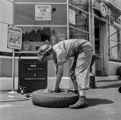 June 1943. "Philadelphia, Pennsylvania. Miss Natalie O'Donald, service station attendant at an Atlantic Refining Company garage." Medium-format negative by Jack Delano for the Office of War Information. View full size.