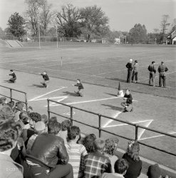 October 1943. Washington, D.C. "Woodrow Wilson High School cheerleaders leading students in a yell at a football game against Georgetown Preparatory." Photo by Esther Bubley for the Office of War Information. View full size.