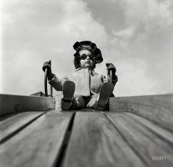 March 1944. "Children playing on the roof of the Lighthouse, an institution for the blind, at 111 East 59th Street, New York." Photo by Richard Boyer for the Office of War Information. View full size.