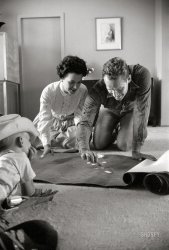 July 1959. "Actor Charlton Heston at the site of his house being constructed in Coldwater Canyon, a hillside community above Beverly Hills. Includes Heston inspecting construction and wiring; playing with son Fraser; looking at house plans with wife Lydia." Photo by Earl Theisen for the Look magazine assignment "The house that Ben-Hur built." View full size.