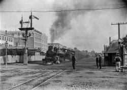 New Zealand in 1909. "The Rotorua Express leaving Auckland, alongside Customs Street East." Glass negative by A.P. Godber. View full size.