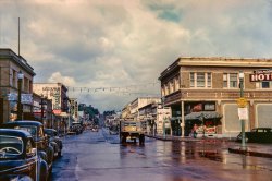 "Astoria '44" is the latest Kodachrome from Navy photographer's mate Don Cox. The view here is looking west along Commercial Street at the intersection with 14th. View full size.