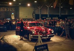 Los Angeles. July 28, 1947. "Tucker Torpedo (i.e., the Tucker 48) -- Pan Pacific Auditorium." 35mm Kodachrome slide by our West Coast correspondent Don Cox. View full size.

Tucker and Car Seek Plant Here

&nbsp; &nbsp; &nbsp; &nbsp; Preston Tucker, 44-year-old inventor, racing car designer and promoter, and his Tucker automobile arrived by plane yesterday -- Tucker in one and the Tucker car in another. The car -- a handmade rear-engined job which does without such conventional gadgets as transmission, clutch, carburetor, drive shaft and water radiator -- is on display at Pan-Pacific Auditorium at the inventors' exhibit.
&nbsp; &nbsp; &nbsp; &nbsp; Tucker said he is negotiating for a wartime airframe plant here to be used eventually as the Tucker West Coast assembly plant. He said he expects to begin production in the wartime Dodge engine plant in Chicago by October with nearly 1,000 cars a day the goal by Jan. 1.&nbsp; &nbsp; &nbsp; &nbsp;  -- Los Angeles Times, July 13, 1947

