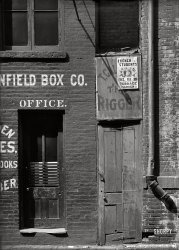 &nbsp; &nbsp; &nbsp; &nbsp; The Penfield Box Co. at 21 Gold Street.
Circa 1893-1899. "Doorways to two businesses, New York City." Tuesday at the Terrace Garden: the French Students' bal masque. Glass negative by Robert L. Bracklow. View full size.