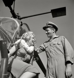 Marilyn Monroe and Navy pilot snapped by Charlotte Brooks in 1952 for the Look magazine assignment "Helicopter View of L.A." Also, a nice lei. View full size.
