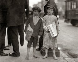 May 1915. "Nine-year-old newsie and his 7-year-old brother 'Red.' Tough specimen of Los Angeles newsboys." Photo by Lewis Wickes Hine. View full size.