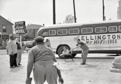 April 1955. "Duke Ellington and band members playing baseball in front of their segregated motel while touring in Florida." Who'll be first to locate the Astor? From photos by Charlotte Brooks (who died this month at age 95) for the Look magazine assignment "A Living Legend Swings On." View full size.