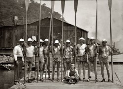 Syracuse varsity crew team at the boathouse with coach Ten Eyck circa 1908. Bain News Service glass negative. View full size.