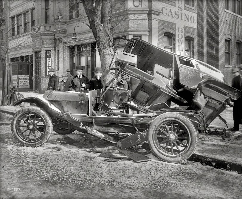 Gutter Ball: 1916 February 4, 1916. Washington, D.C. "Auto wreck at 14th & T," under a light dusting of snow and mold. Continuing the thread of vehicular mayhem we started earlier today. National Photo Company Collection glass negative. View full size.