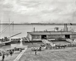 The Ohio River circa 1905. "The levee -- Louisville, Kentucky." This barge was last seen here; the large barrel-like containers are hogsheads of tobacco. At left, the bow of the sternwheeler Georgia Lee in a continuation of this view. 8x10 inch dry plate glass negative, Detroit Publishing Company. View full size.