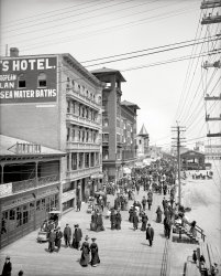 Circa 1905. "Boardwalk, Atlantic City." Strollers on parade, at least one beach baby, and a number of ponies. Detroit Publishing glass negative. View full size.
