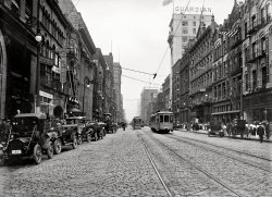 Cleveland, Ohio, in 1911. "Euclid Avenue." Painless dentists and quick-service lunchrooms in easy walking distance. 5x7 glass negative. View full size.