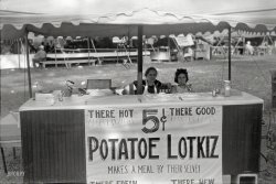 August 1938. "Refreshment stand at county fair, central Ohio." Photo by Ben Shahn for the Farm Security Administration. View full size.