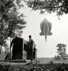 May 1942. "Parris Island, South Carolina. Tactical formations of barrage balloons prevent dive bombing and the strafing of important ground installations. The Leathernecks are developing an excellent technique in this method of protecting important locations from enemy aircraft." Photos by Alfred Palmer and Pat Terry for the Office of War Information. View full size.