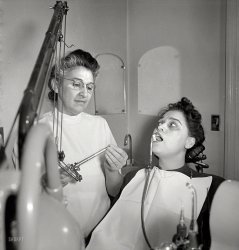 New York, 1942. Kathryn Crum, the wife of bandleader Eddie South, in the dental chair. Another of Albert Fenn's uncaptioned photos from the OWI archive. Now, Mrs. South, if you'll just open a little wider, this won't hurt a bit. View full size.