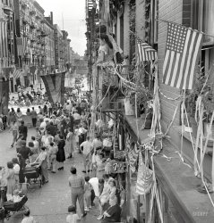 August 1942. New York. "Dancing and music on Mott Street at a flag raising ceremony in honor of neighborhood Italian boys in the Army." Medium-format negative by Marjory Collins for the Office of War Information. View full size.