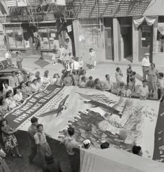 August 1942. "Italian-American parade honoring neighborhood boys in the United States Army." A close-up of the banner glimpsed here. (The bottom, just out of the frame at right, reads WE MUST NOT FAIL THEM.) Medium-format negative by Marjory Collins for the Office of War Information. View full size.