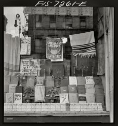 August 1942. "Window of a Jewish religious shop on Broome Street." We'll take a calendar and two cans of Magic, please. Medium format nitrate negative by Marjory Collins for the Office of War Information. View full size.