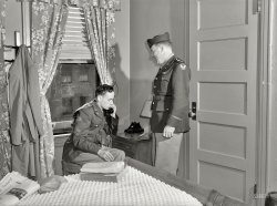 December 1943. Washington, D.C. "A lieutenant in the Army Air Transport Command calling the airport to check on flight conditions before checking out at the United Nations service center." Medium-format safety negative by Esther Bubley for the Office of War Information. View full size.