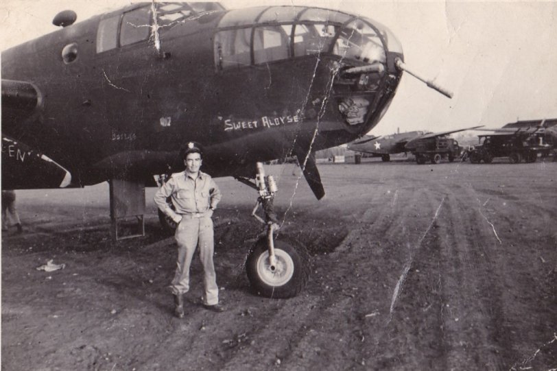 Sweet Aloyse: 1943 A former beau of my late mother in law, Aloyse Aubrey; she did NOT marry him. I have forgotten his name, but the back of the photo says: "B-25c #42-64513, 'Rafisque' Army Air Base, Dakar, W. Africa, 4/26/43." It looks like this is one of the stops used to ferry bombers to the North African theater. It also looks like this airman didn't put a lot of time into painting the nose of his bomber. View full size.