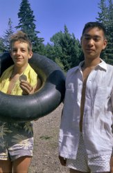 Well, it's vacation time, and what better destination than the beach in 1960? My brother snapped me and his Cal Poly college chum Bob (who you may recall from Christmas Special) along the Russian River at Guernewood, California in July of that year, just one month before my 14th birthday. I believe my exceptionally stylish swim trunks are 1940s vintage hand-me-downs from my father. Hair by beach towel. 35mm Kodacolor negative. View full size.