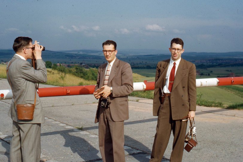 The Third Man: 1951 Occupied Germany at the U.S.-Soviet sector The East/West German border circa 1951, ten years before the Berlin Wall was built. U.S. Army soldiers Harry Manville, Dave Crosson, and Ray Kwapil (my dad). I have the Agfa Karat 35mm and Rolleicord 6x6cm Dad is dangling. Nice cameras, they are still working.
Location: "Untersuhl by Eisenach, Germany, East-West German border on Autobahn" is written on the slide mount. Another of Dad's photos is here: Munich c. 1952. | View full size.